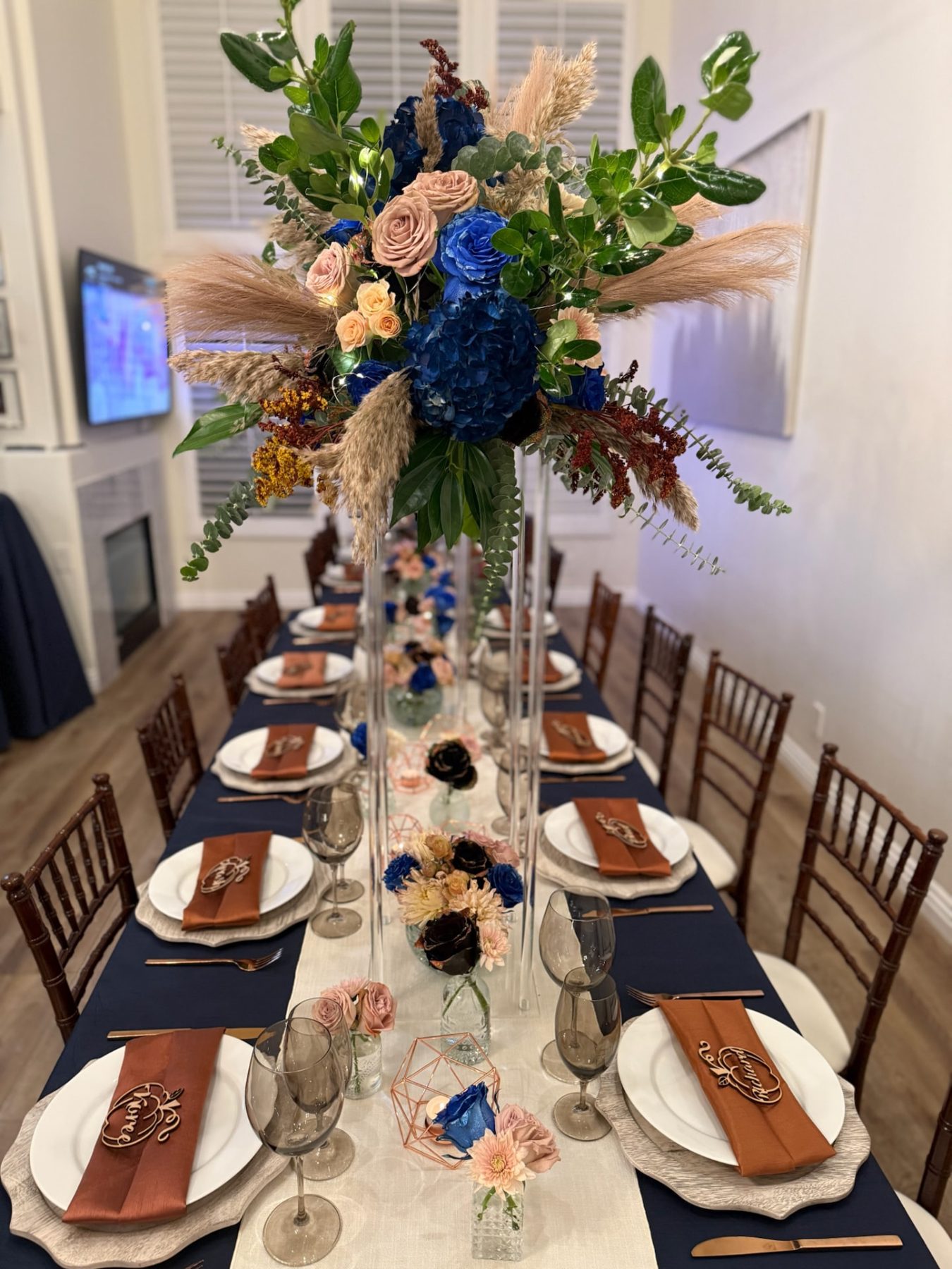 Elevated centerpiece over a navy runner