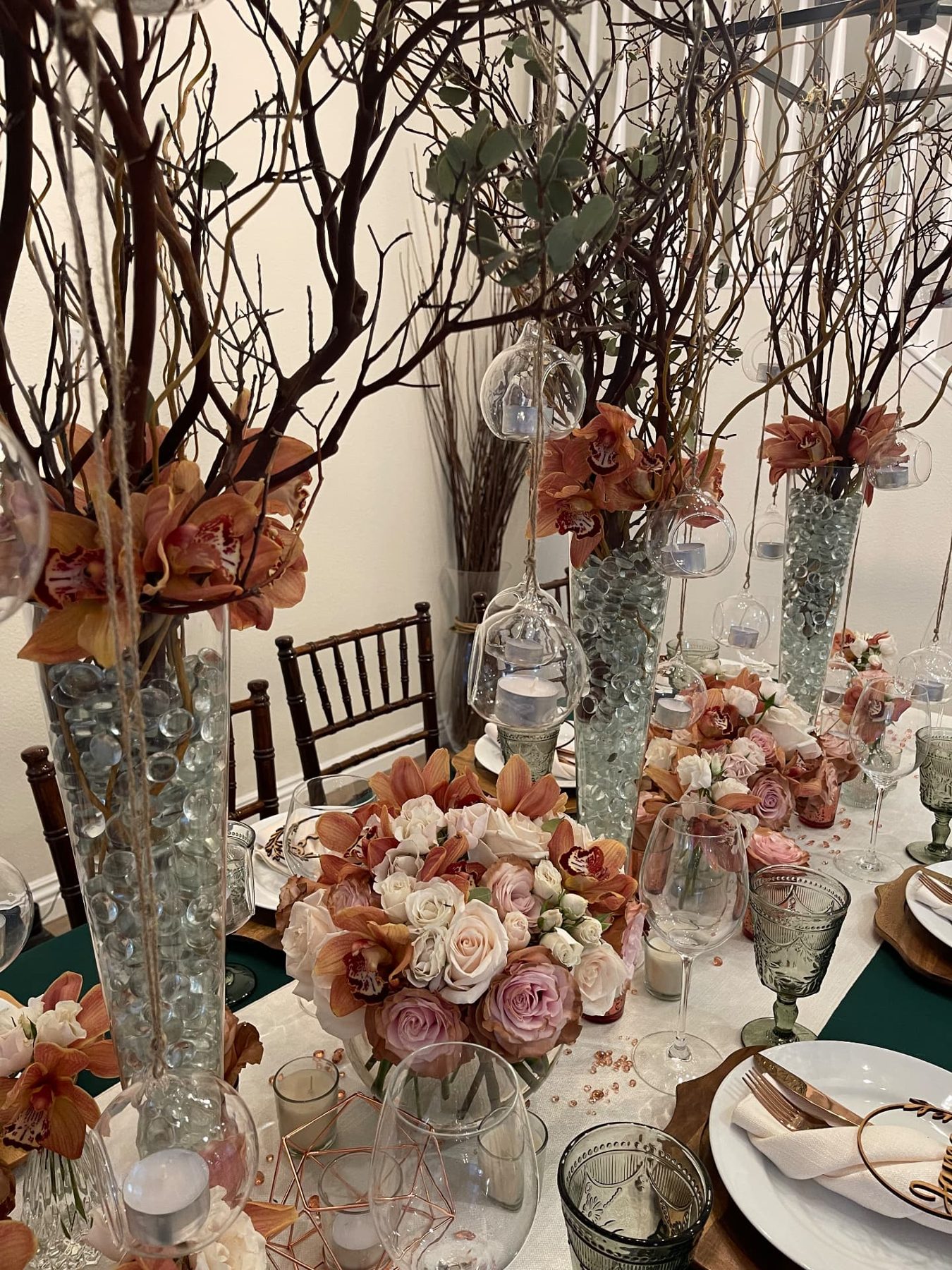 Crystal, branch and candlelight tablescape
