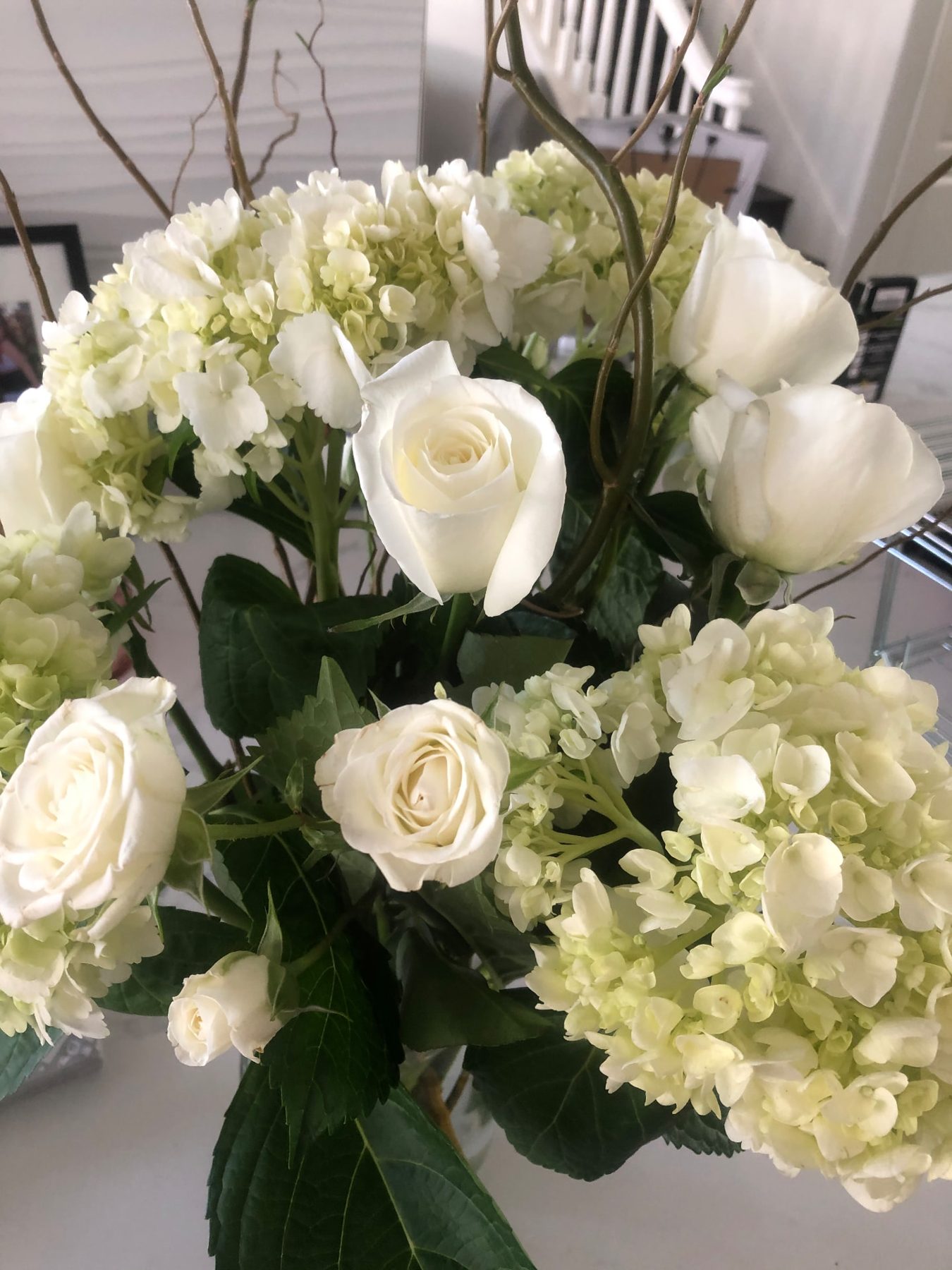 White hydrangea and rose arrangement