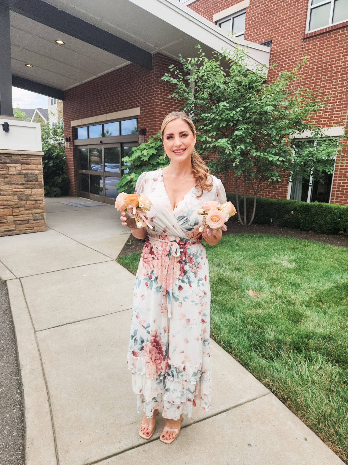 Leslie Wilson holding an armful of garden roses