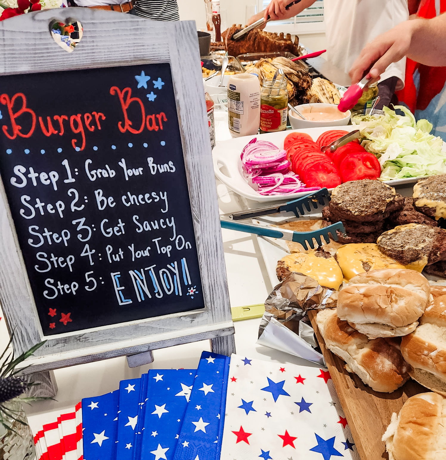 Hand-lettered burger bar sign with star-print napkins
