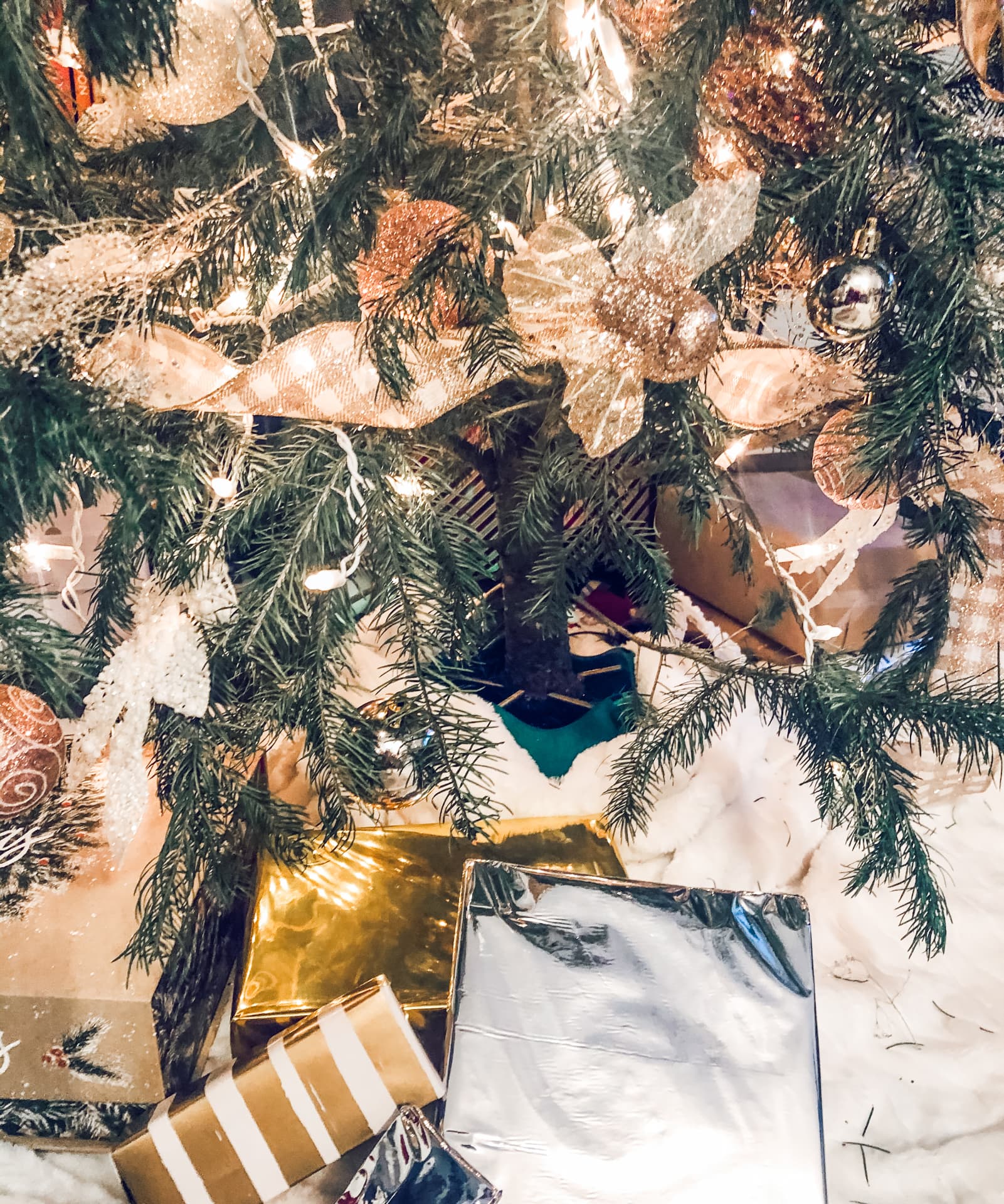 Gilded packages and glittered blooms beneath the tree